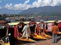 Dal Lake in Srinagar agog with activity after easing of security restrictions with the departure of Prime Minister Manmohan Singh from the valley on Tuesday. PTI