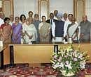 National Advisory Council Chairperson Sonia Gandhi and members meet Prime Minister Manmohan Singh in New Delhi on Thursday after the first meeting of the newly constituted Council. PTI