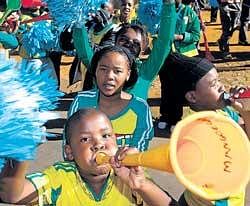 Football fever: Fans sing and dance on the eve of the soccer World Cup in Mohlakeng, South Africa, on Thursday.  Getty images