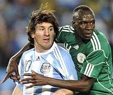 Nigeria's Sani Kaita(R) tries to block Argentina's Lionel Messi during the World Cup group B soccer match between Argentina and Nigeria at Ellis Park Stadium in Johannesburg, South Africa, on Saturday. AP