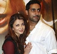 Indian Bollywood actors Abhishek Bachchan (R) and his wife Aishwarya Rai Bachchan (L) attend a promotional event for the upcoming Bollywood film "Raavan" in Mumbai