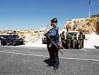 An Israeli policewoman stands at the scene of an attack near the West Bank Jewish settlement of Beit Hagai. REUTERS