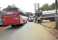 Parking Anarchy: A lorry parked in front of a shop impedes vehicular movement on Shidlaghatta road in Chikkaballapur. DH Photo