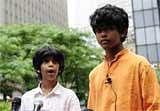 Kids for a Better Future founder Akash Mehta, 12, (L) and his brother Gautama, 15 address a press conference in front of a law office representing Union Carbide Corporation and its former CEO Warren Anderson, on June 14, 2010 in New York.  AFP PHOTO