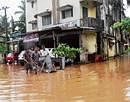 Water Worries: Some shops at Ujjodi in Mangalore that were inundated in the rain on Tuesday. DH Photo