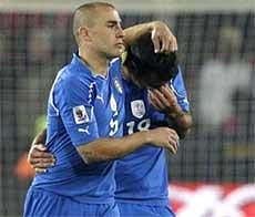 Italy's Fabio Cannavaro (left) comforts team mate Fabio Quagliarella at the end of the match against Slovakia in Johannesburg. AP