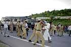 cane charge: Police personnel caning protesting farmers near Hemmigepura on Sunday.  DH Photo