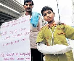 Hapless victim Rathikanth seen with his father. DH photo