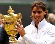 Spain's Rafael Nadal holds the Wimbledon Trophy after beating Czech Republic's Tomas Berdych in the Men's Singles Final at the Wimbledon Tennis Championships at the All England Tennis Club, in south-west London on Sunday. AFP