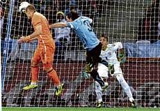 Nod of God: Arjen Robben climbs high to head home the Netherlands third goal in their 3-2 victory over Uruguay in Tuesdays semifinal in Cape Town. AP
