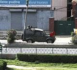 An Indian Army jeep patrols a deserted street during curfew in Srinagar on Wednesday. AP Photo