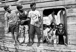 In search of new life: A picture taken on October 22, 2009, shows Sri Lankan asylum-seekers on board their boat moored at Merak seaport in Serang district on Indonesias Java island, after they were stopped by Indonesian authorities on their way to Australia. AFP