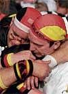 It's s'pain'ful German supporters are inconsolable after their teams defeat to Spain in the semifinal. Reuters