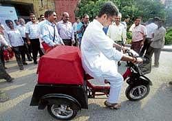 Union MoS for Communications & IT Sachin Pilot rides a Soleckshaw (solar rickshaw) during its launch for use as a green postal delivery vehicle in New Delhi on Friday. PTI