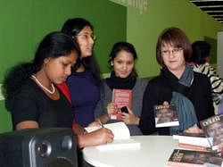Hall of fame: Domestic help Baby Halder putting her autograph on the copies of the French translation of her book A Life Less Ordinary.
