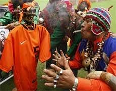 Shamans stand around a replica of the Netherlands' soccer jersey as they perform a ritual to send good vibes to the Netherlands' team in Lima on Friday .AP