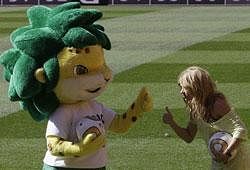 Colombia's singer Shakira, right, pose for photographers with the World Cup soccer mascot Zakumi, as she attends an event at the Soccer City stadium in Johannesburg, South Africa, Saturday July 10, 2010. Where on Sunday will be held the final match of the World Cup between Netherlands and Spain.AP