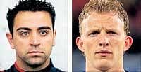Dirk Kuyt (left) of the Netherlands  and Spains Xavi.