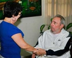 Cuban leader Fidel Castro, right, greets an unidentified woman during a visit to the National Center for Scientific Investigation in Havana  on July 7, 2010. AP Photo/Cubadebate-Alex Castr