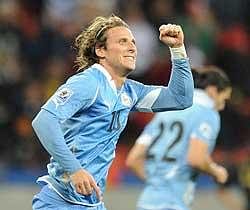 Diego Forlan of Uruguay celebrates after scoring his team's second goal against Germany. AFP