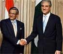 External Affairs Minister S M Krishna shakes hands with his Pakistani counterpart Shah Mahmood Qureshi during a meeting in Islamabad on Thursday. PTI Photo