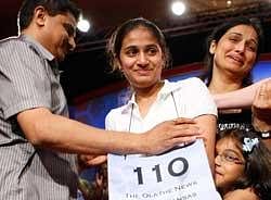 Speller Kavya Shivashankar (centre) with parents after winning the 2009 Scripps National Spelling Bee competition on May 28, 2009 in Washington. File photo