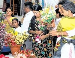 Colourful: Customers purchasing decorative artificial flowers at the expo.