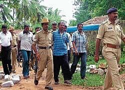 Naxal leader Chandrashekar Gorabal being taken by police to produce in the court on Thursday. DH PHOTO