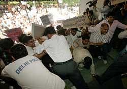 RSS workers vandalise the office of Headlines Today TV channel in New Delhi on Friday. PTI