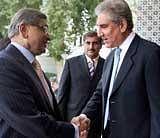 External Affairs Minister S M Krishna and his Pakistani counterpart Shah Mahmood Qureshi (R) shake hands prior to formal talks in Islamabad on Thursday. PTI