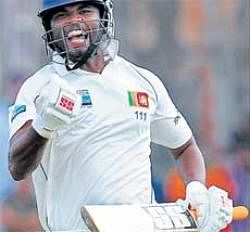 I did it: Tharanga Paranavitana celebrates after reaching his maiden Test ton in Galle on Sunday. AFP