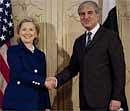 U.S. Secretary of State Hillary Clinton poses for pictures with Pakistan Foreign Minister Shah Mahmood Qureshi before their meeting in Islamabad, Pakistan on Monday. AP Photo