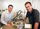 INNOVATORS:  Chemist and researcher Erik Sher and molecular biologist Alex Tkachenko with a mass spectrometer. (Jim Wilson/The New York Times)