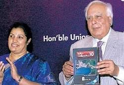 Human Resource Development Minister Kapil Sibal releases a CD as Minister of State D Purandeswari looks on, during the launch of Mass Media Studies and Geo-spatial Practices courses in CBSE at Secondary Level, in New Delhi on Monday. PTI