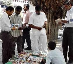Raking moolah: The DVD sellers are mostly seen on  footpath under the shade of a tree.