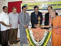 Pejawar Math Swamiji Vishveshwara Theertha Swamiji inaugurating the Allahabad bank branch in Udupi. dh photo