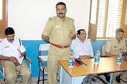 Law enforcement  Circle Inspector of Police  Shivakumar speaking at an interaction with auto  drivers in Chikkaballapur on Monday. Regional Transport Officer K K Khan and inspector Harsha are also seen. DH Photo