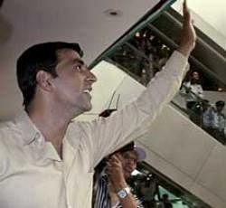 Bollywood actor Akshay Kumar waves to his fans during a promotion of his upcoming movie "Khatta Meetha" in Ahmadabad, India, Monday, July 19, 2010. The film will be released on July 23. AP
