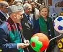 Afgan President Hamid Karzai (L) and US Secretary of State Hillary Clinton (2nd R) tour a crafts baazar in a nearby courtyard in Kabul on July 20, 2010, as they attend the International Conference on Afghanistan. US Secretary of State Hillary Clinton told a major international conference in Kabul July 20 that there was still "much more work" for the Afghan government to do to stabilise the country. AFP