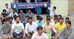 Karnataka Dalit Praja  Sene members staging a protest in front of the taluk office at Bangarpet on Tuesday alleging atrocities against Dalits.  DH Photo