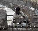 A labourer works at the construction site of a flyover in Chennai in this February.  file photo. Reuters