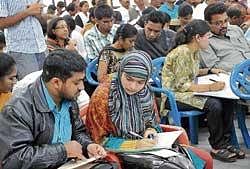 for right choice: Students and parents attending the engineering courses selection round at the CET Counselling Centre in Bangalore on Thursday.  DH Photo