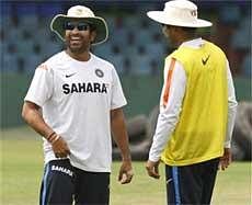 Sachin Tendulkar and Virender Sehwag shares a light moment during practice session at the Sinhalese Club ground in Colombo on Saturday. AP