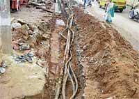 Collateral Damage: Underground telephone cables, which have been exposed due to digging for drainage work near SP Office in Chikkaballapur. DH Photo