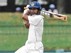 Cut and Thrust:  Kumar Sangakkara slams a boundary en route to his hundred against India in Colombo on Monday. AFP