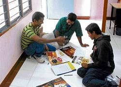 New Horizon Engineering College students making posters.