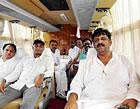 rest for the road: KPCC Working President D K Shivakumar and other Congress leaders  rest inside the bus on the third day of the padayatra in Kuluvanahalli on Tuesday. dh Photo