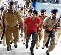 Security Ring: Underworld don Abu Salem arrives at the Bhopal railway station on Tuesday before he was produced in the district court in connection with a fake passport case. PTI
