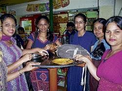 Girls enjoying the food. DH photo by Rajani Hegde