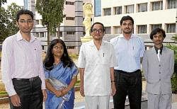 Proud:  Rajath, Rekha, Harsha and Guruprasad along with principal Rajanikanth (centre).